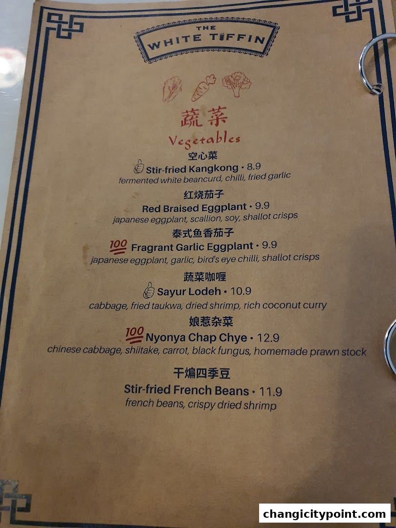 A menu page from The White Tiffin featuring a selection of vegetable dishes.