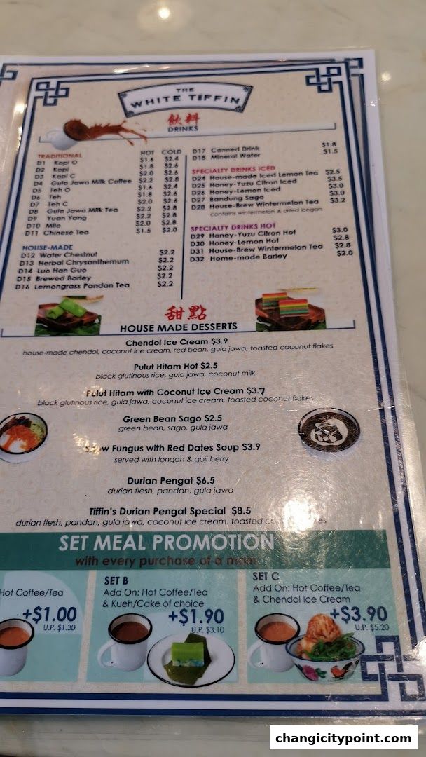 A menu from The White Tiffin featuring drinks, desserts, and set meal promotions.