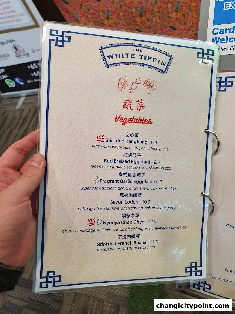 A menu from The White Tiffin featuring a 'Vegetables' section with various dishes.