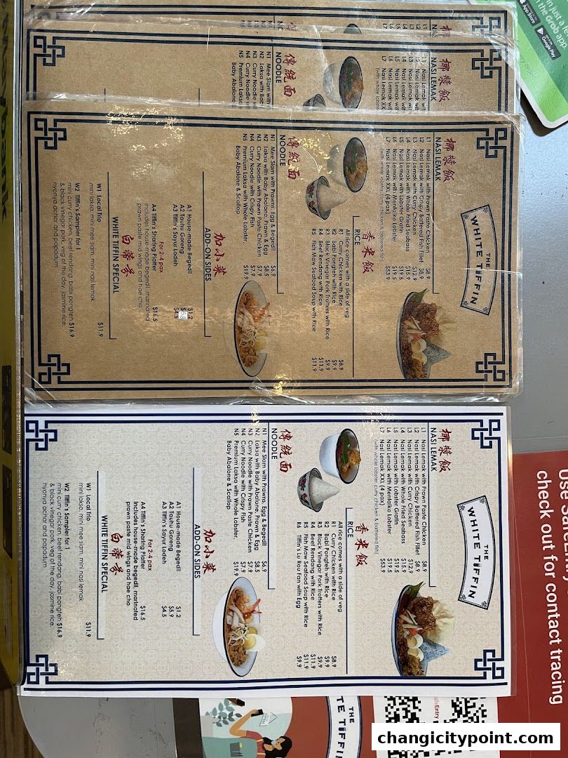 A menu from The White Tiffin restaurant featuring Nasi Lemak, Noodles, and Rice dishes.