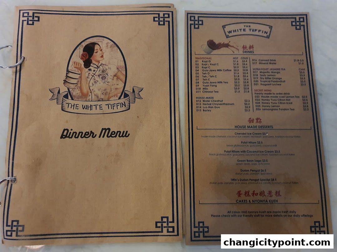 A menu from The White Tiffin featuring drinks and house-made desserts.