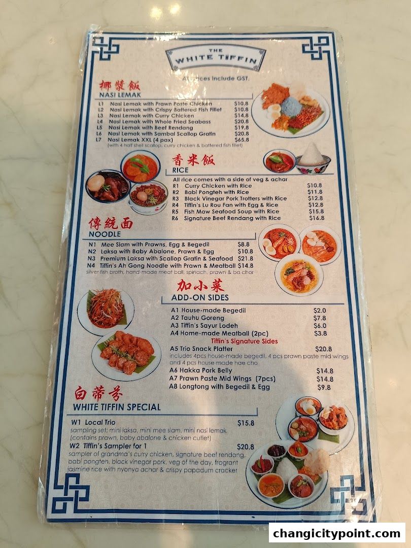 A menu from The White Tiffin featuring Nasi Lemak, Rice, Noodles, Add-on Sides, and Specials.