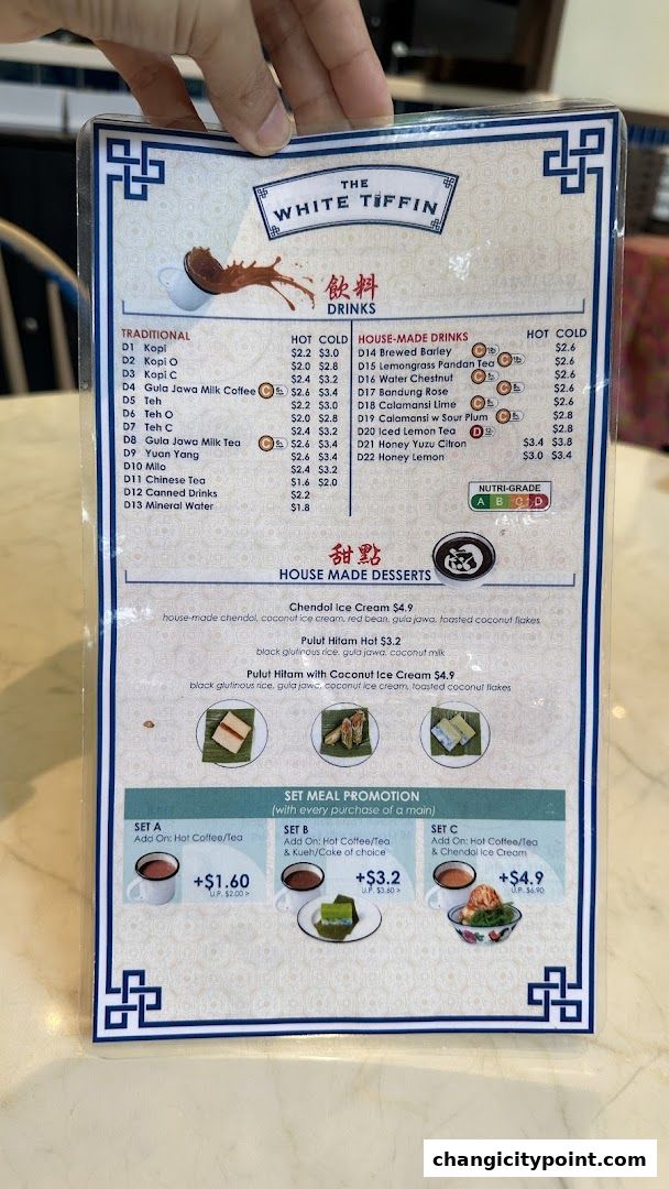 A menu from The White Tiffin featuring drinks and desserts with prices.