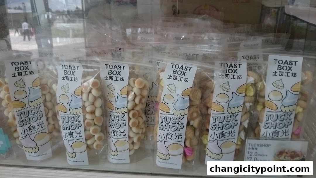 Packaged snacks from Toast Box, featuring 'Tuck Shop' branding with illustrated food items.