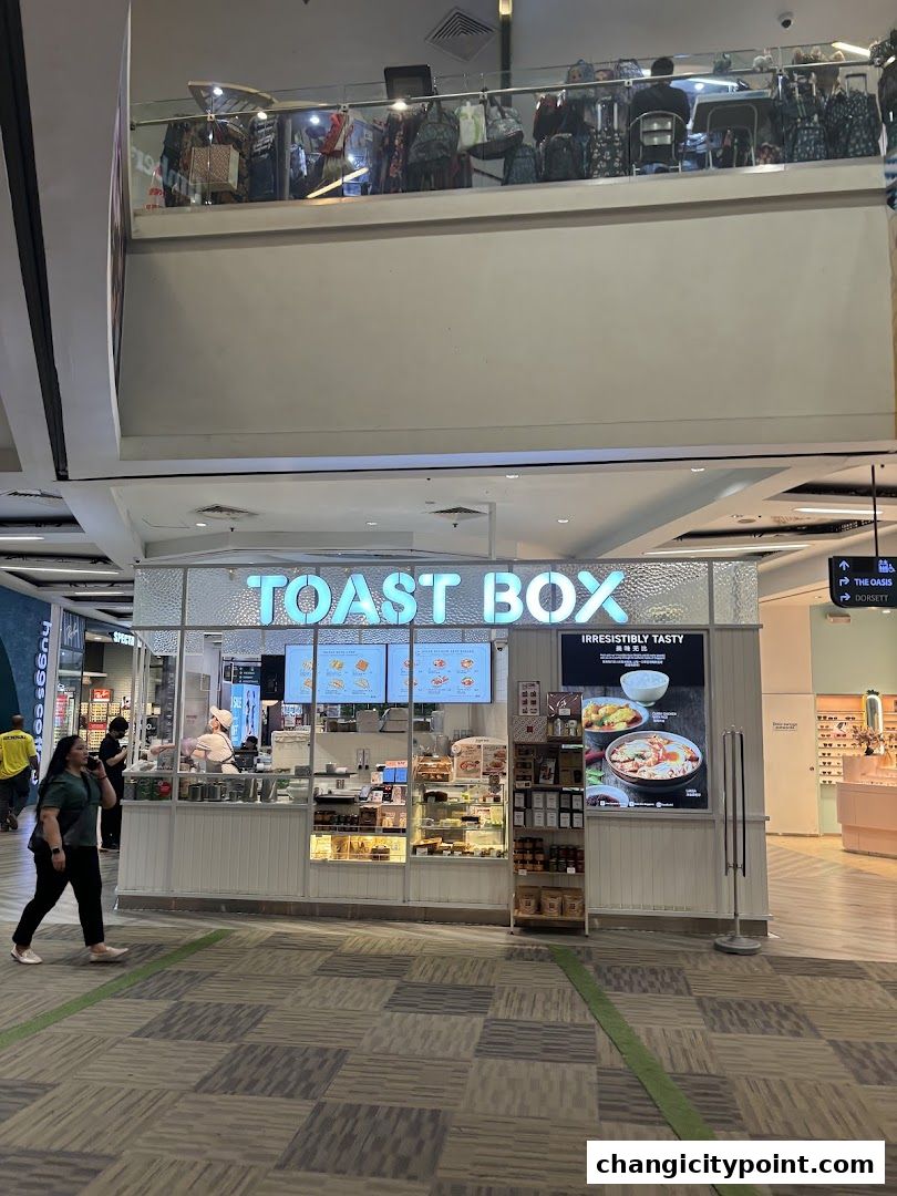 Toast Box shop front with display cases and menu boards inside a shopping mall.