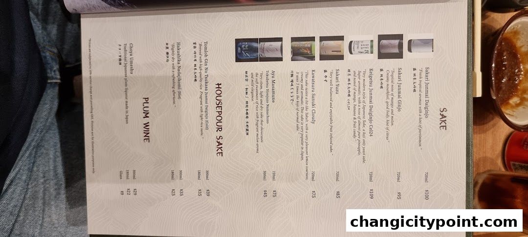 A menu page featuring various types of Sake and Plum Wine with descriptions and prices.