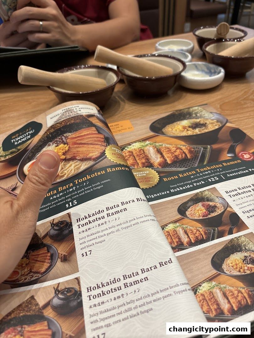 A menu from Tonkatsu ENbiton Changi City Point featuring various tonkotsu ramen dishes.