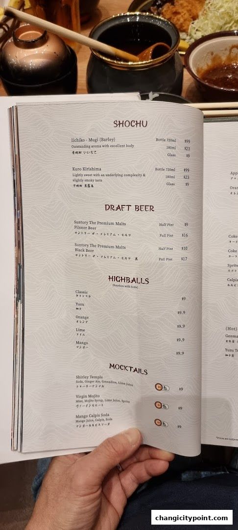 A menu page displaying Shochu, Draft Beer, Highballs, and Mocktails with prices.