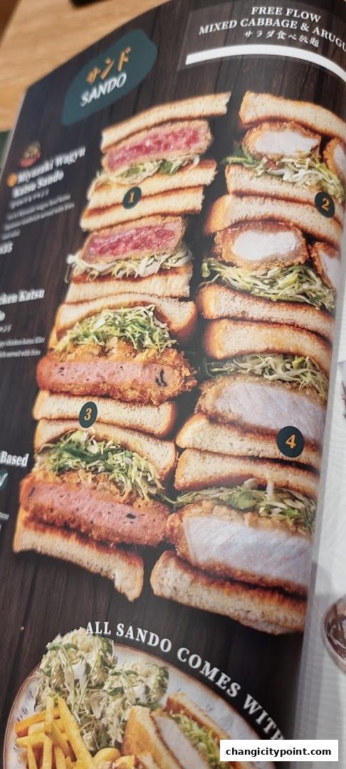 A menu showcasing various katsu sando sandwiches with free-flow cabbage and arugula.