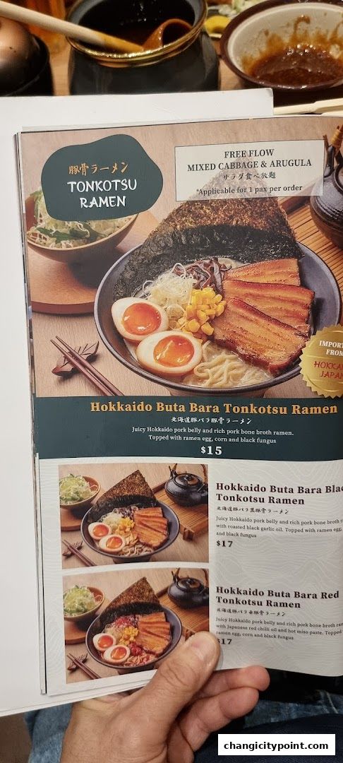 A menu showcasing various Tonkotsu Ramen dishes with pork belly and toppings.
