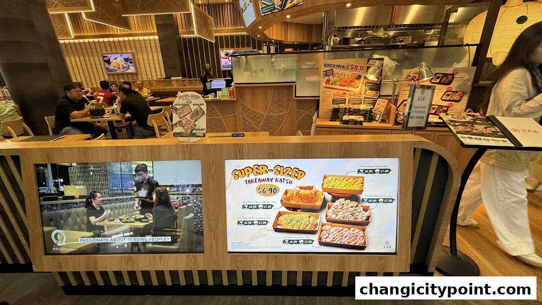 Interior view of Tonkatsu ENbiton restaurant with takeaway katsu promotion.