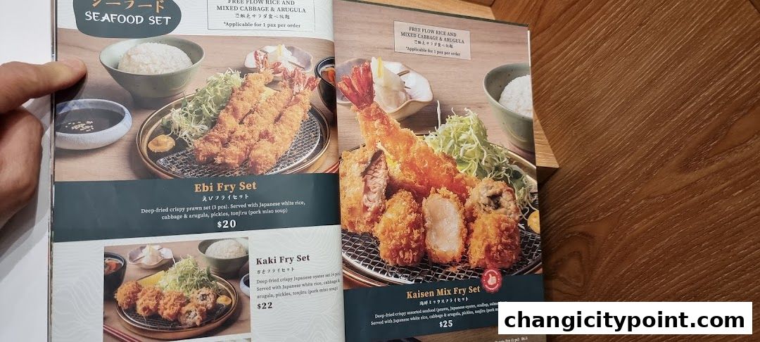 A menu page showcasing various deep-fried seafood and pork sets with rice and soup.
