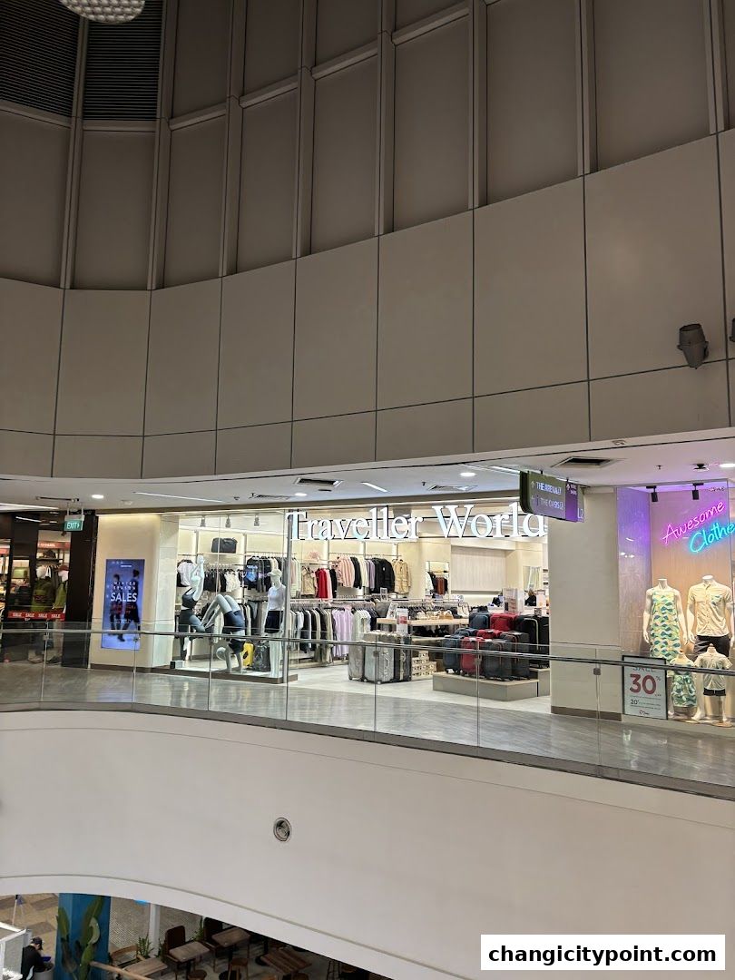 Traveller World shop displaying clothing and luggage with sale signs.
