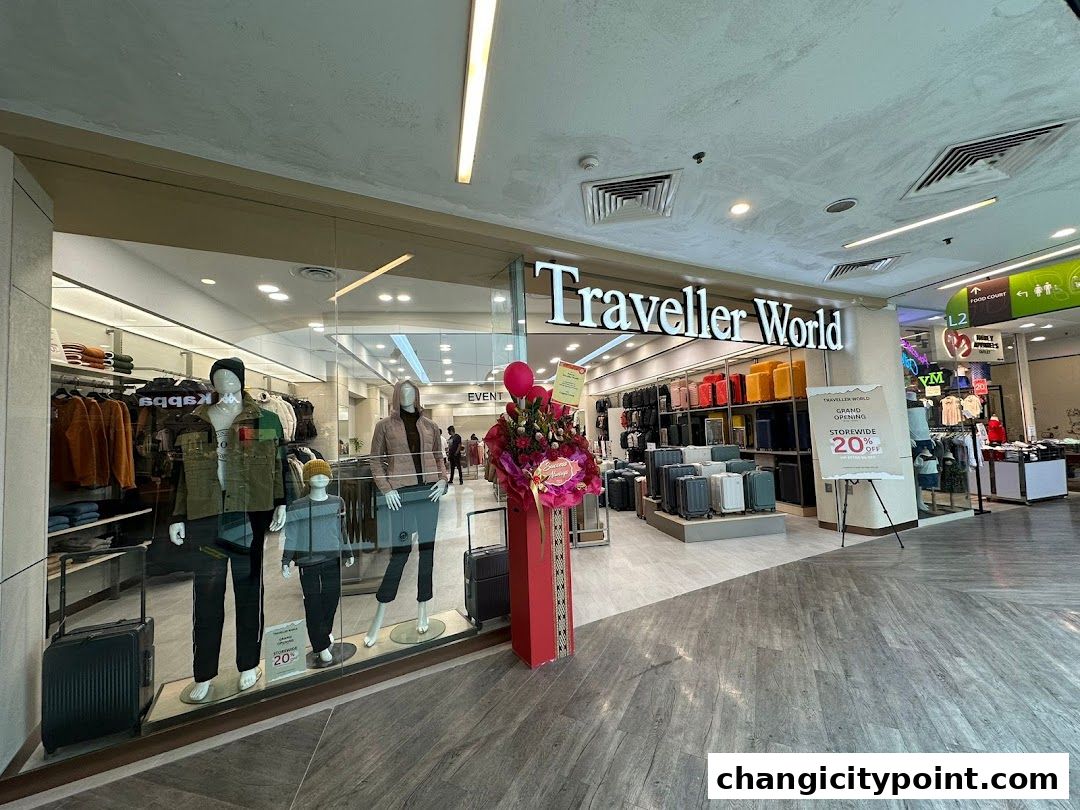 Traveller World shop front with mannequins, luggage, and a grand opening sale sign.