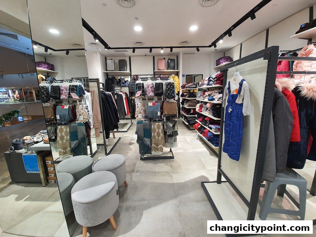 Interior view of a clothing store displaying winter wear and accessories.