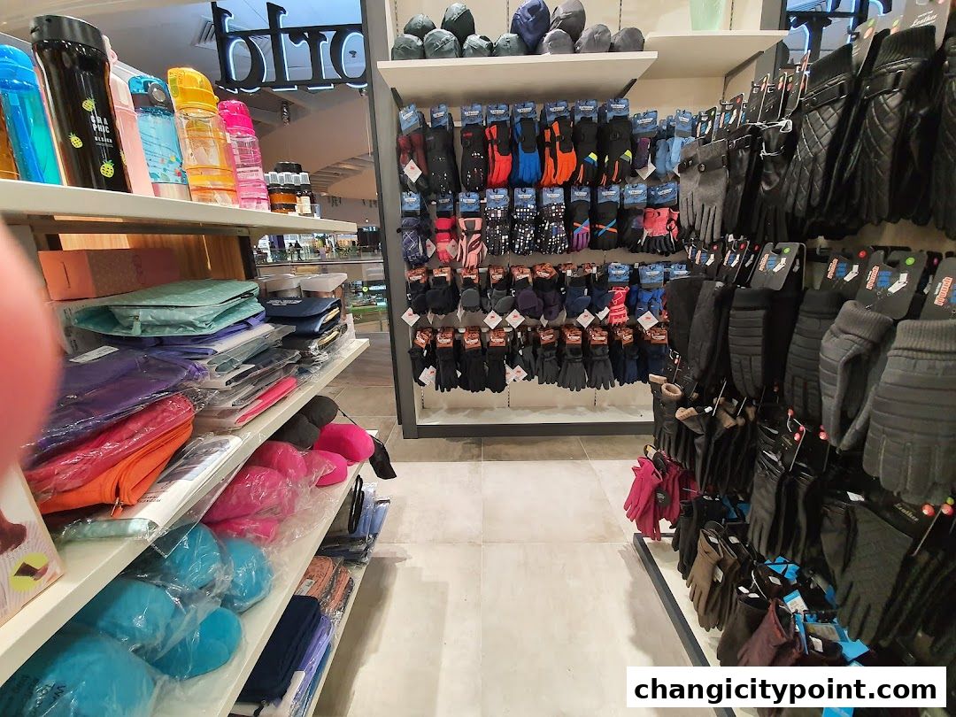 Shelves stocked with colorful water bottles, bags, and a wide variety of gloves.