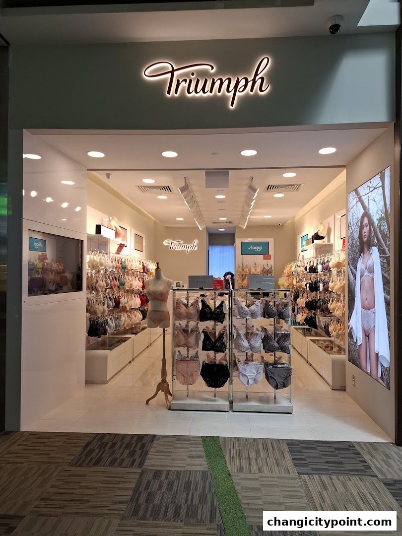Triumph lingerie store entrance with displays of bras and underwear.