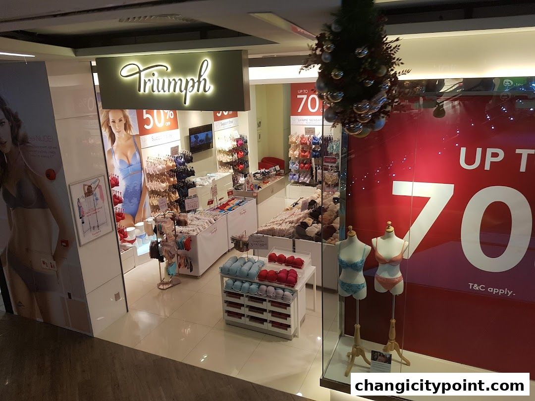 Triumph lingerie store with sale signs and mannequins displaying bras.