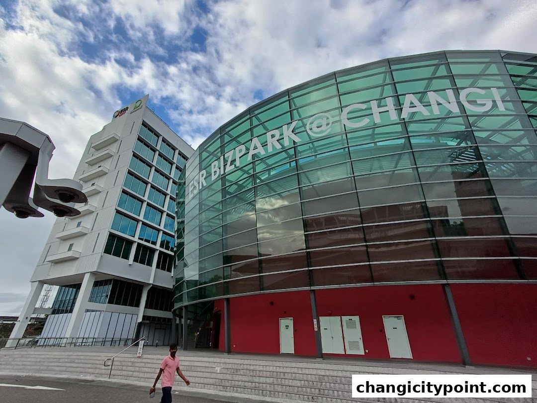 Modern architecture of ESR Bizpark @ Changi with glass facade and red base.