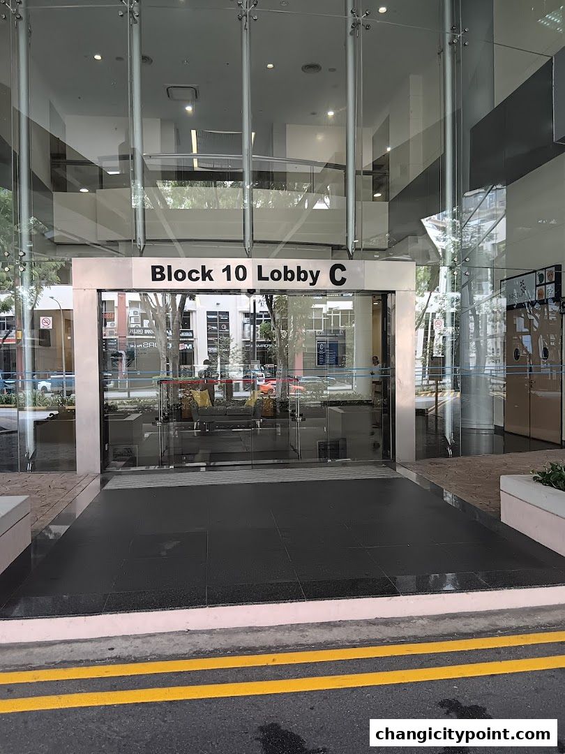 Entrance to Block 10 Lobby C with glass doors and signage.
