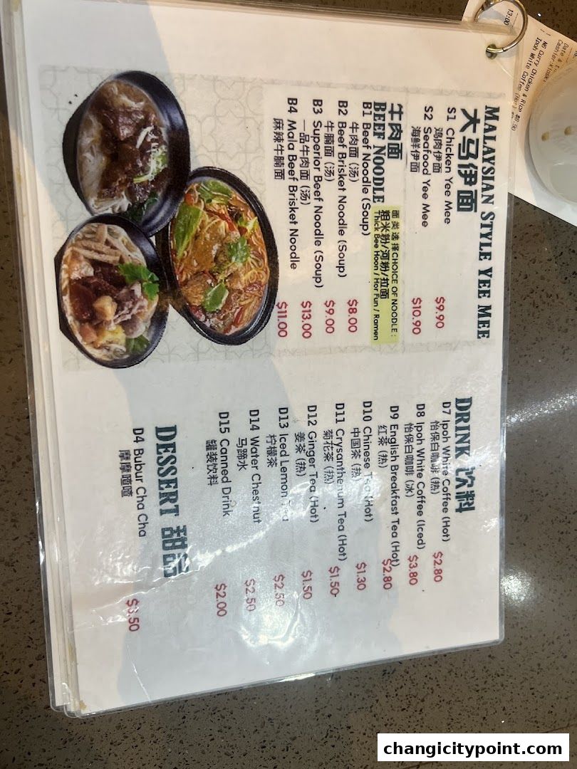 A menu from Uncle Johns Makan Place featuring Malaysian style Yee Mee, beef noodles, drinks, and desserts.