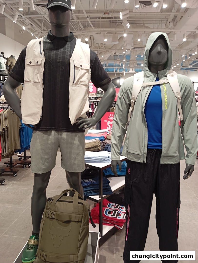 Mannequins display athletic wear and accessories inside an Under Armour store.