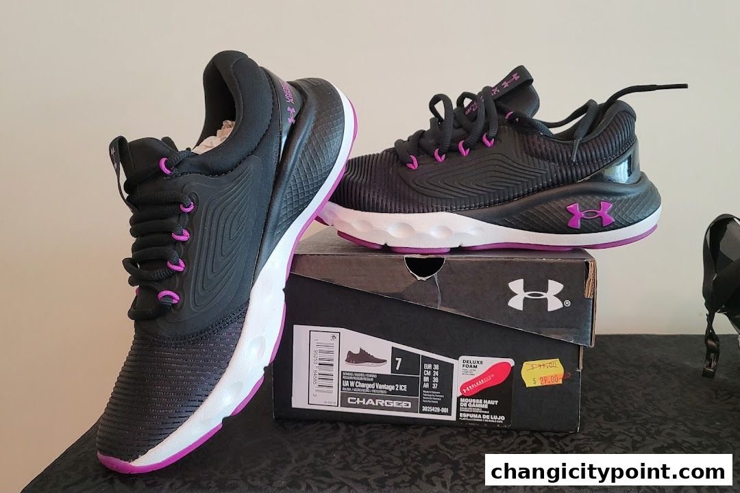 Black and purple Under Armour Charged Vantage 2 ICE women's running shoes with box.