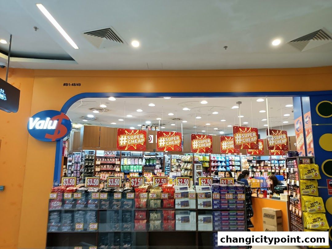 The Valu shop front displays a wide variety of products with prominent 'Super Cheap' signage.