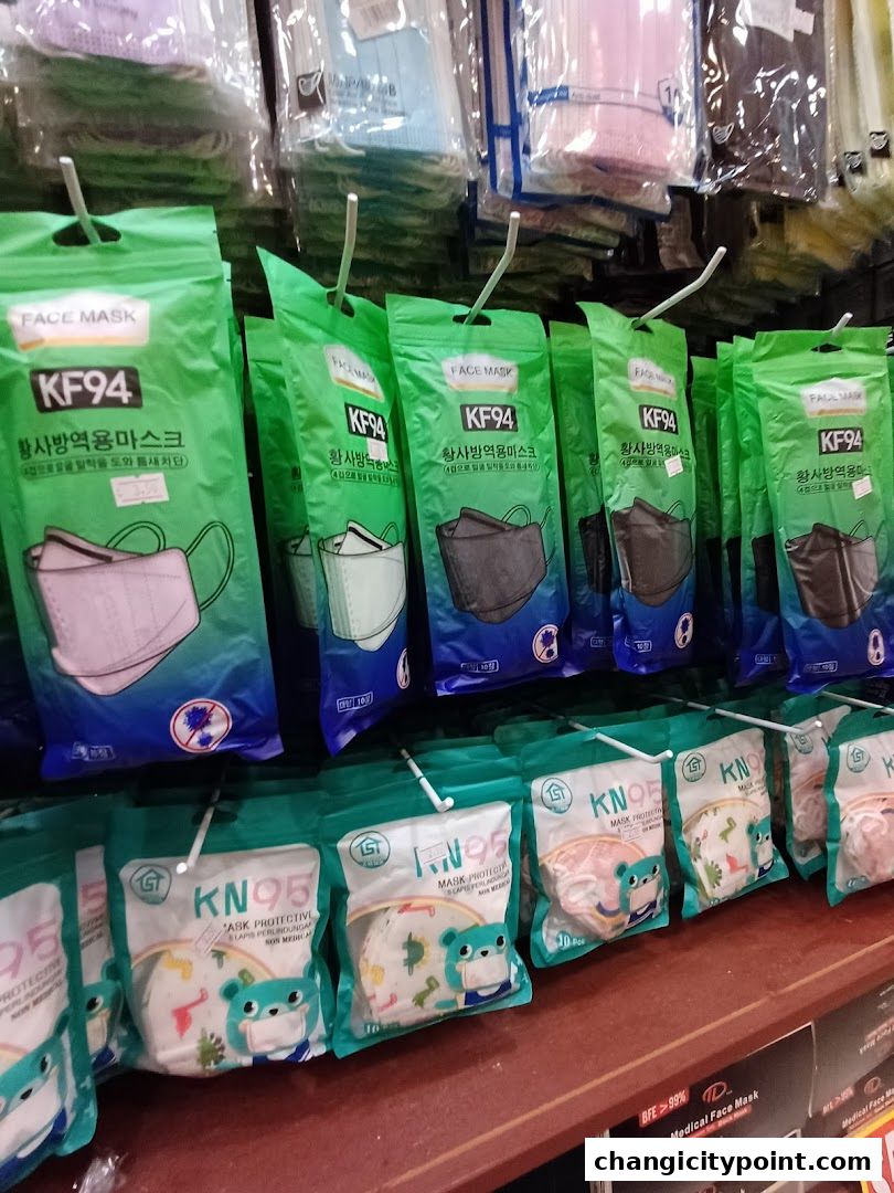 Shelves stocked with various KF94 and KN95 face masks in colorful packaging.