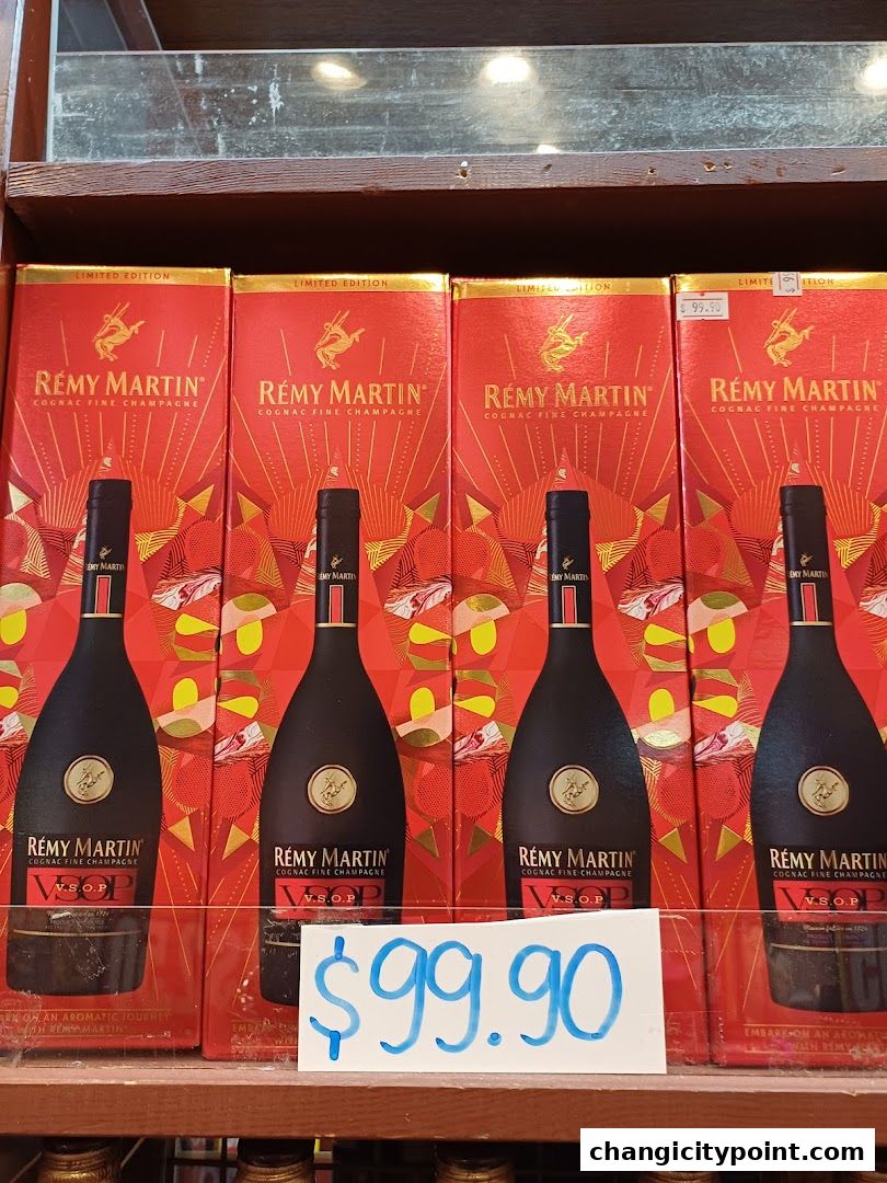 Several bottles of Remy Martin VSOP Cognac are displayed with their limited edition packaging.