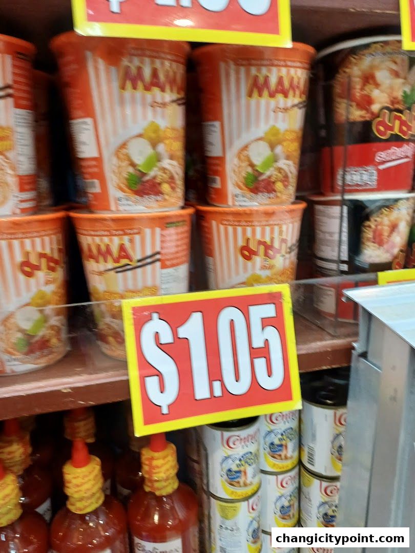 A display of instant noodle cups and canned goods with a price tag of $1.05.