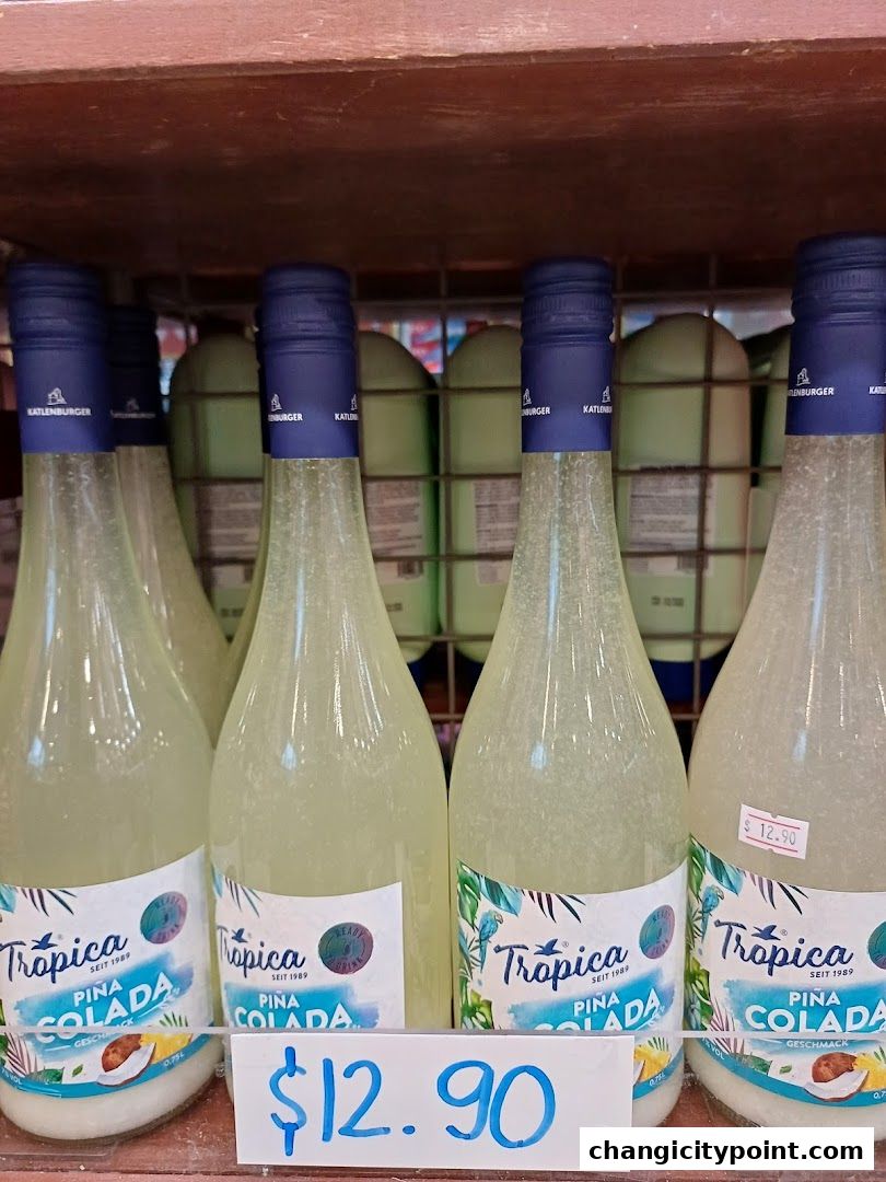 Bottles of Tropica Piña Colada drink displayed on a shelf with price tags.