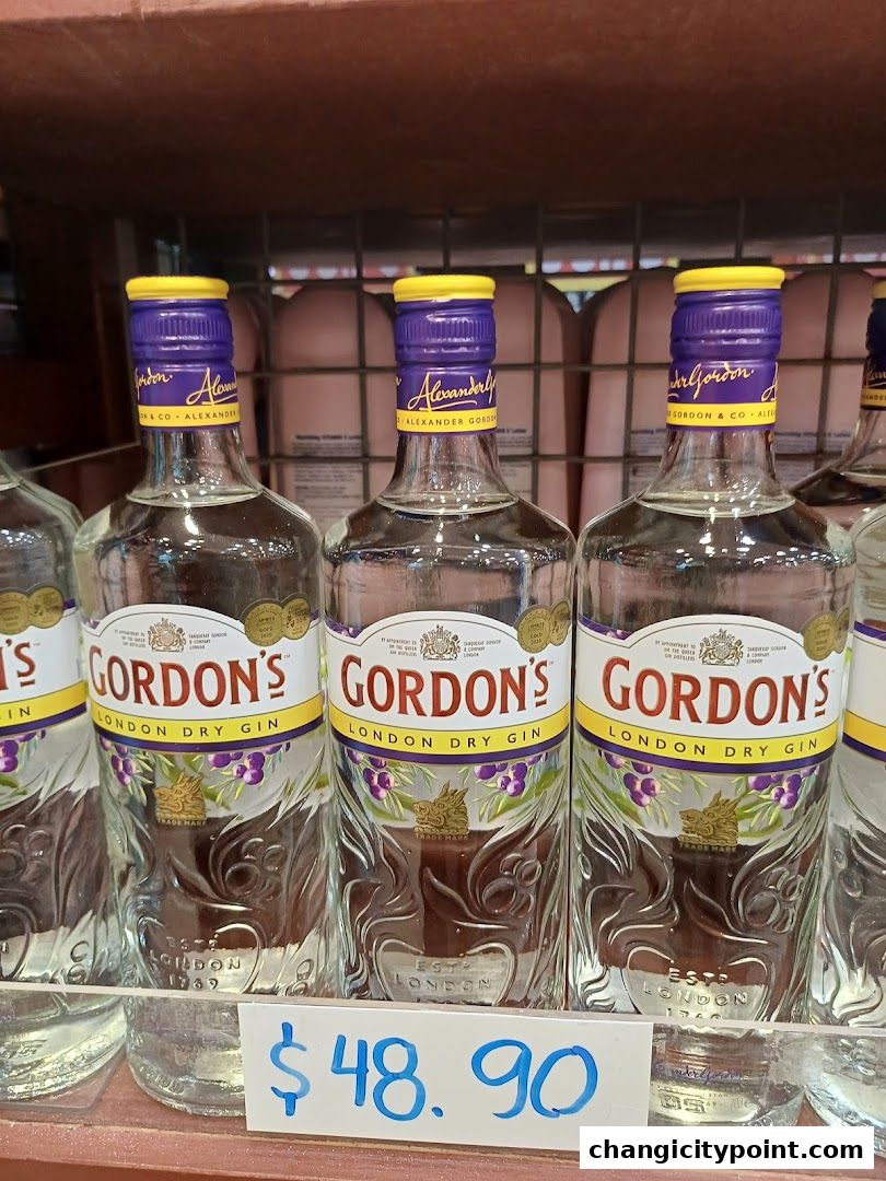 Bottles of Gordon's London Dry Gin are displayed with a price tag of $48.90.