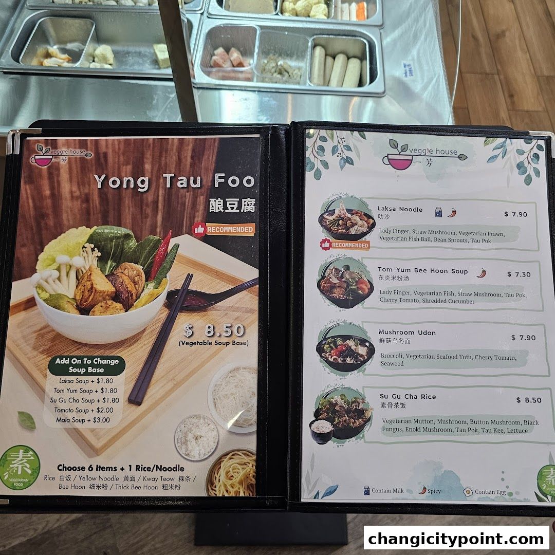 A menu from Veggie House featuring Yong Tau Foo, Laksa Noodle, and other vegetarian dishes.