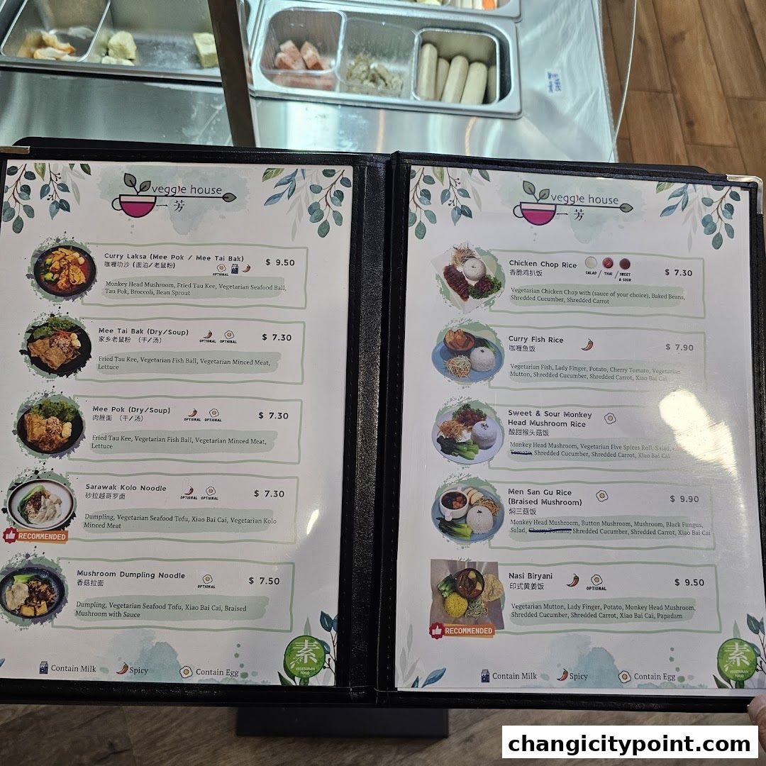 A menu from Veggie House featuring vegetarian dishes with descriptions and prices.