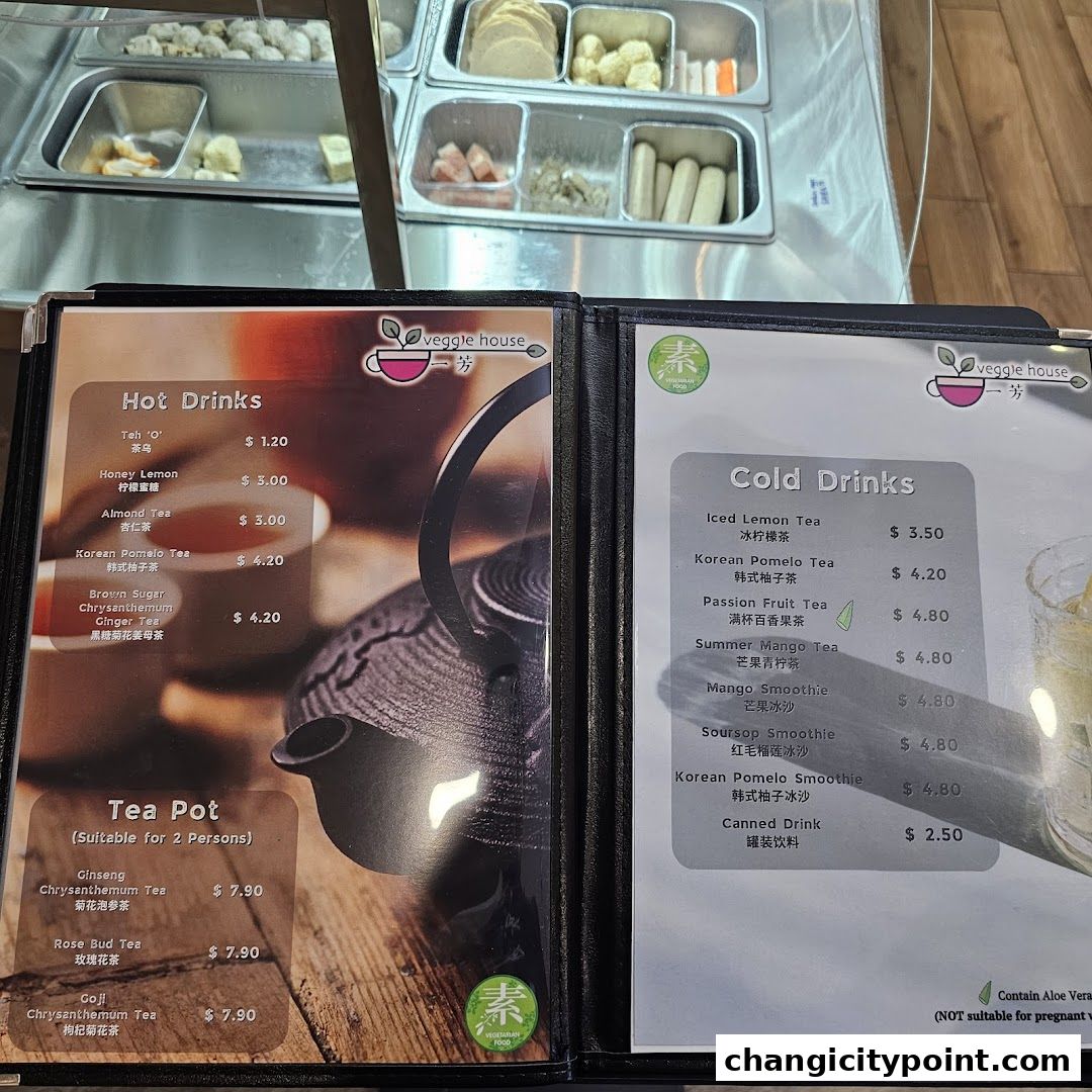 A menu for Veggie House featuring hot and cold drinks, and tea pots.