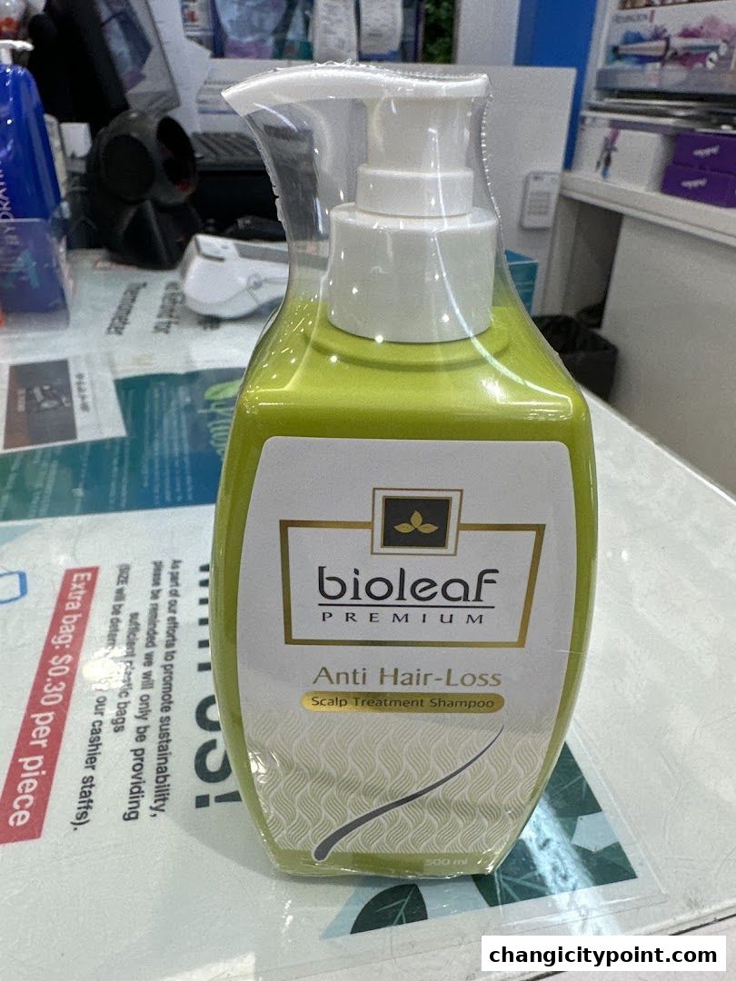 A bottle of Bioleaf Premium Anti Hair-Loss Scalp Treatment Shampoo is displayed.