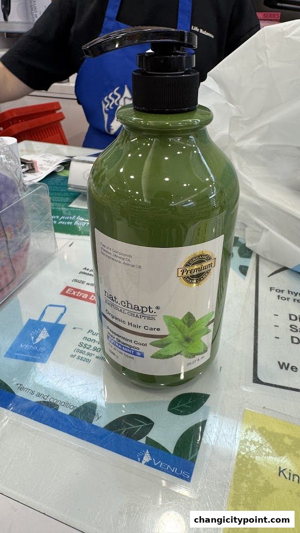 A bottle of Nat. Chapt. Organic Hair Care Peppermint Cool Hair Shampoo is displayed.