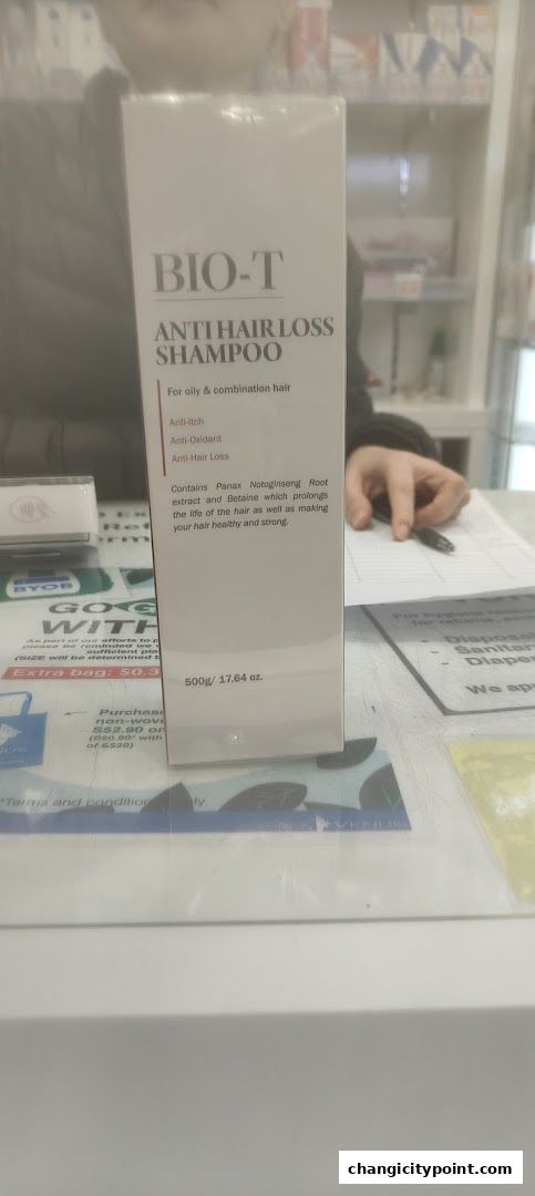 A box of BIO-T Anti Hair Loss Shampoo is displayed on a counter.