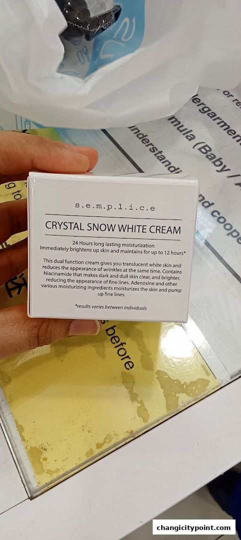 A box of S.E.M.P.L.I.C.E Crystal Snow White Cream with product details.