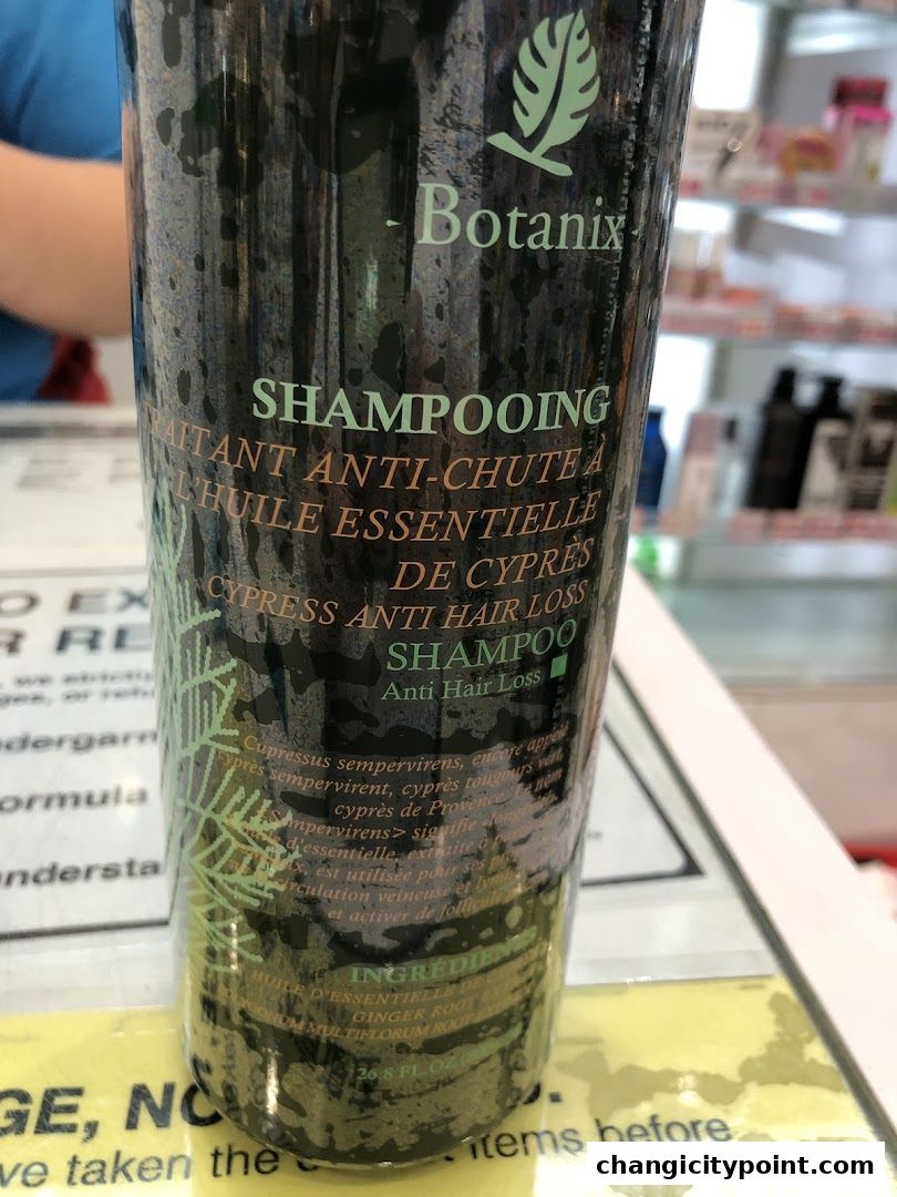 A bottle of Botanix Cypress Anti Hair Loss Shampoo with ingredients listed.