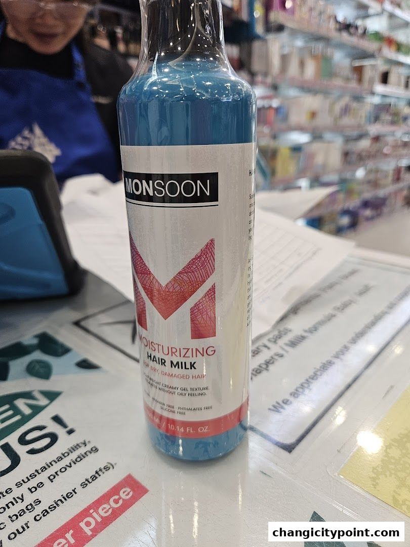 A bottle of Monsoon Moisturizing Hair Milk sits on a counter at Venus Beauty.