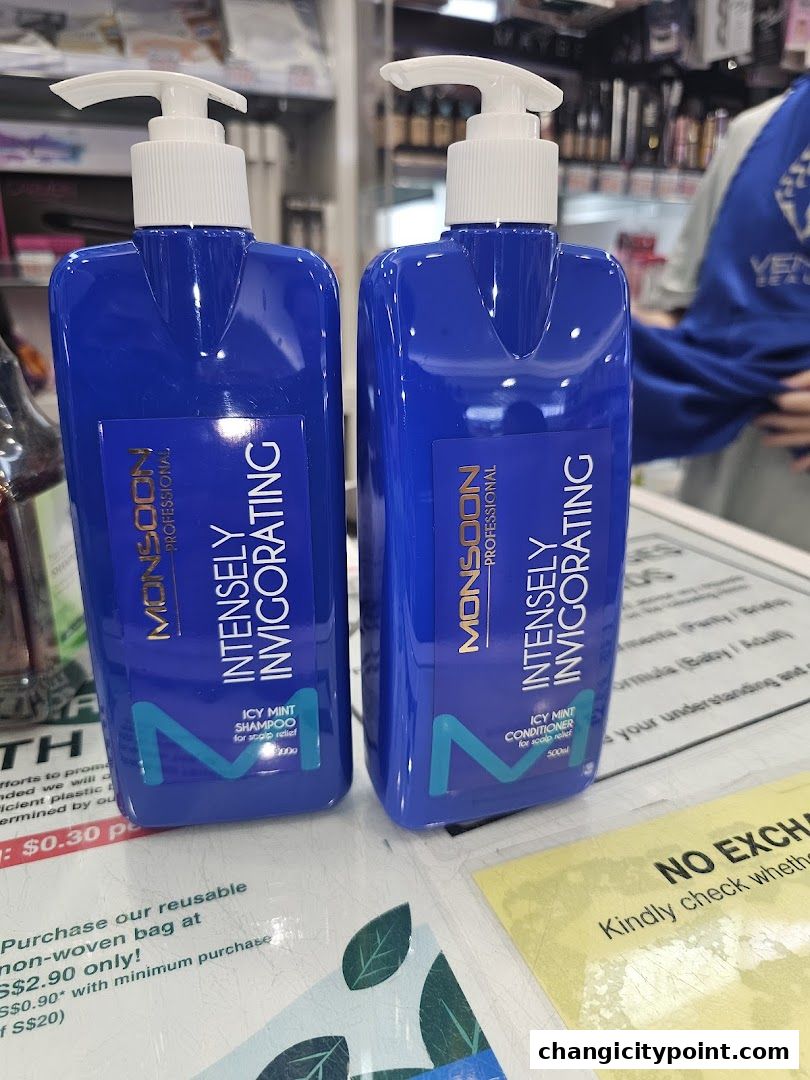 Two blue bottles of Monsoon Professional Icy Mint Shampoo and Conditioner.