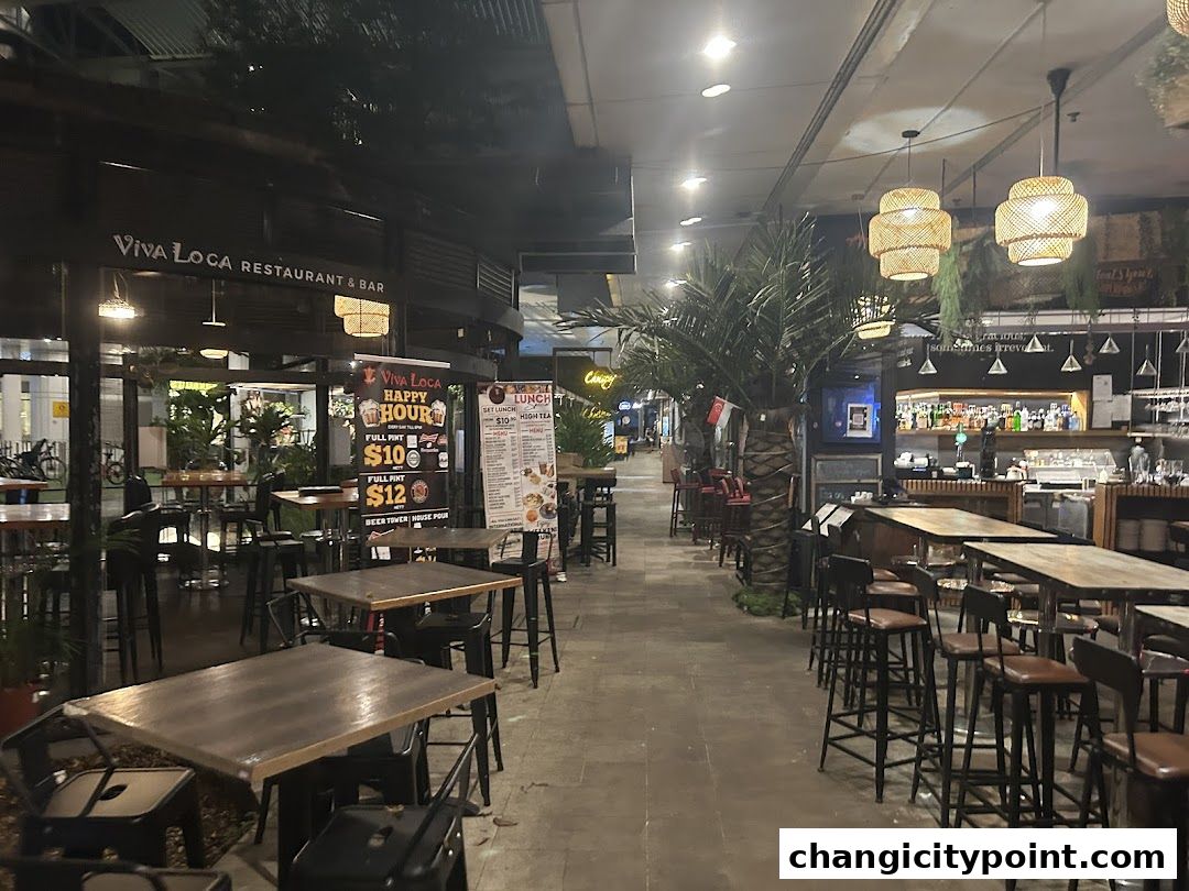 Viva Loca Restaurant & Bar exterior with outdoor seating and a bar visible inside.