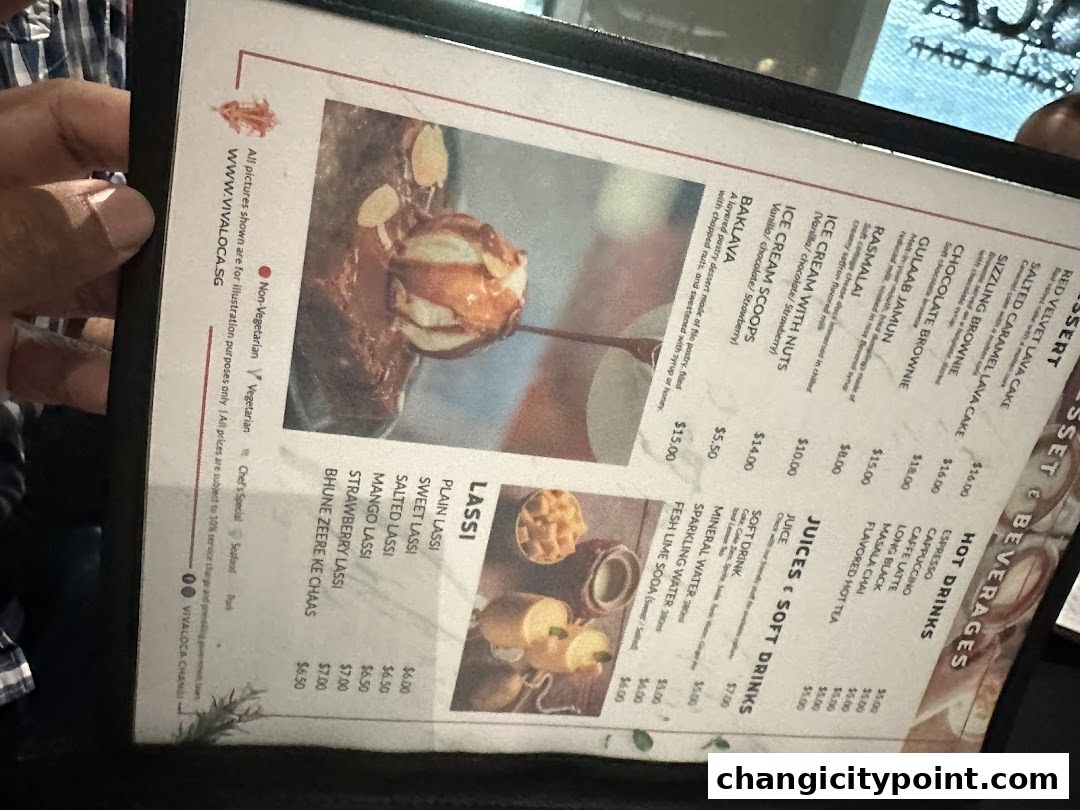 A menu from Viva Loca Changi featuring desserts, lassis, juices, and hot drinks.
