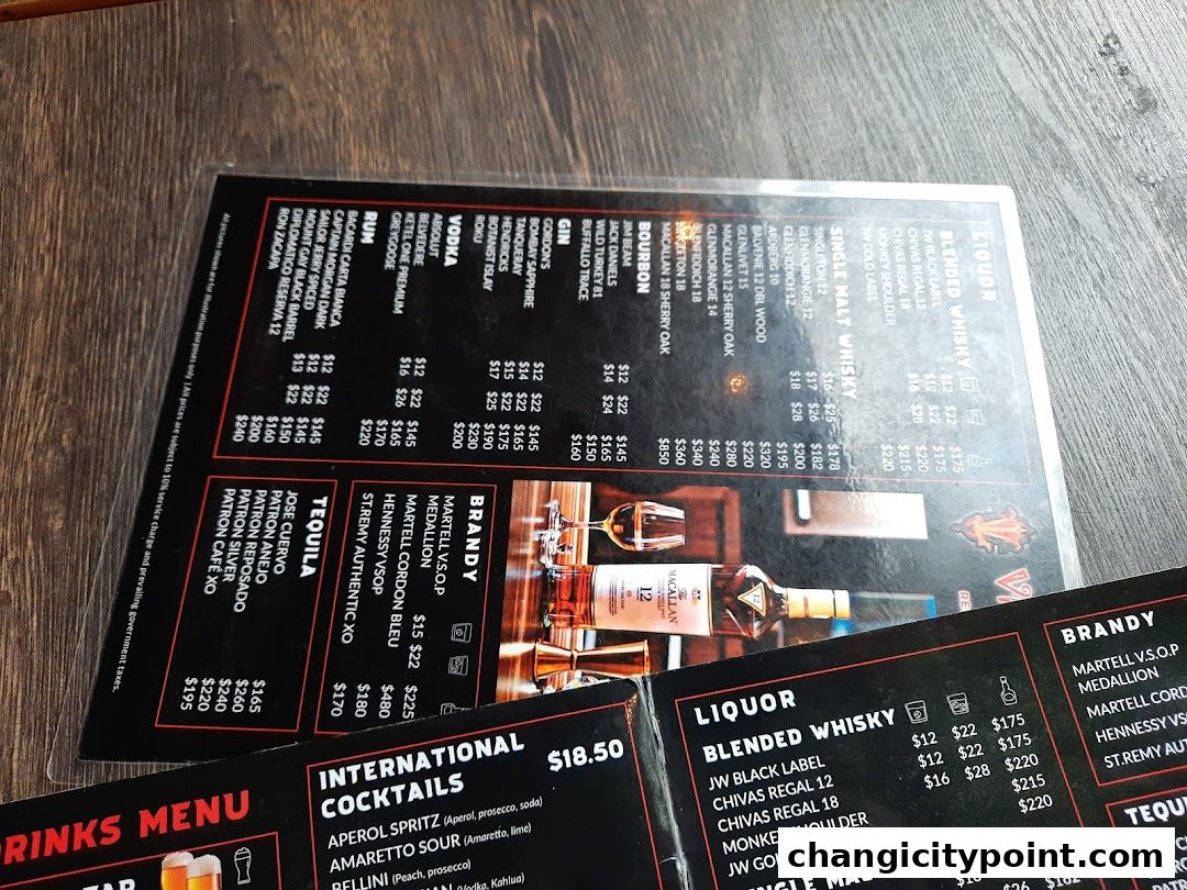 A menu from Viva Loca Changi featuring a wide selection of liquors, brandies, tequilas, and cocktails.