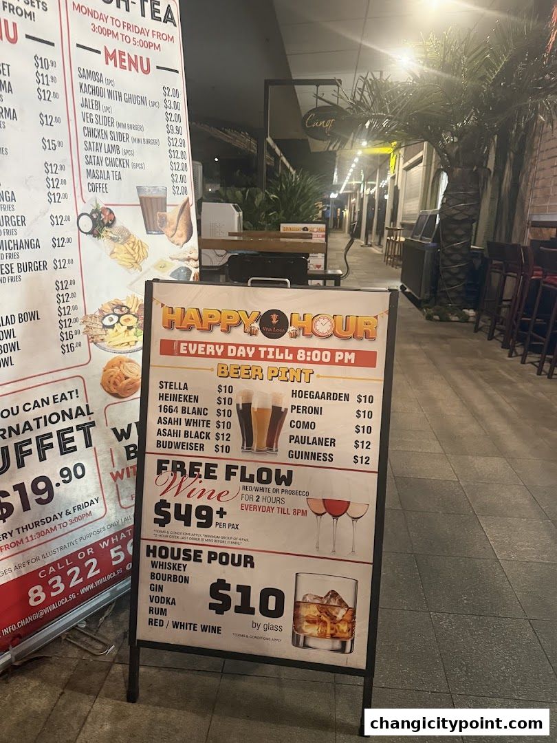 A-frame sign advertising happy hour specials, beer, wine, and house pour drinks.
