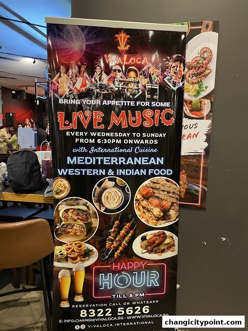 A banner advertising live music, international cuisine, and happy hour at Viva Loca.
