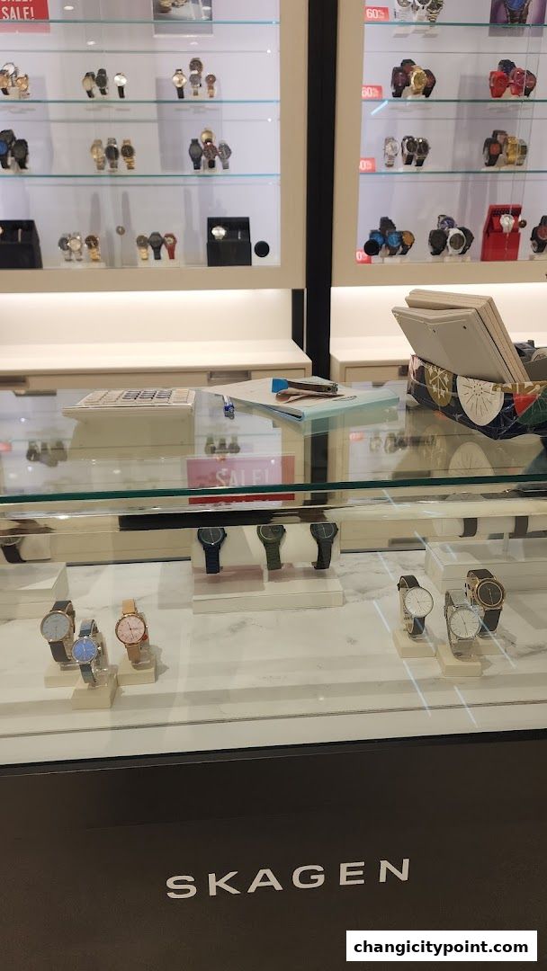 Display of various watches from Fossil and Skagen brands in a retail store.