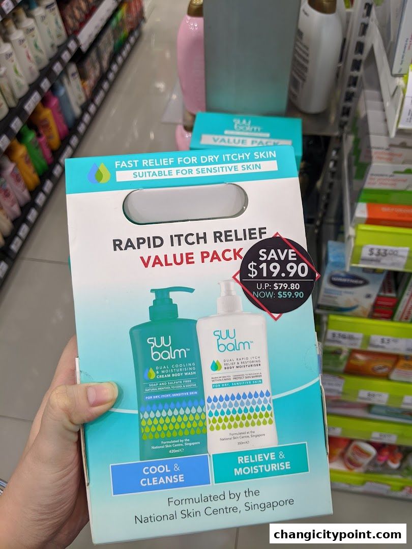 A hand holds a value pack of Suu Balm products for dry, itchy, sensitive skin.